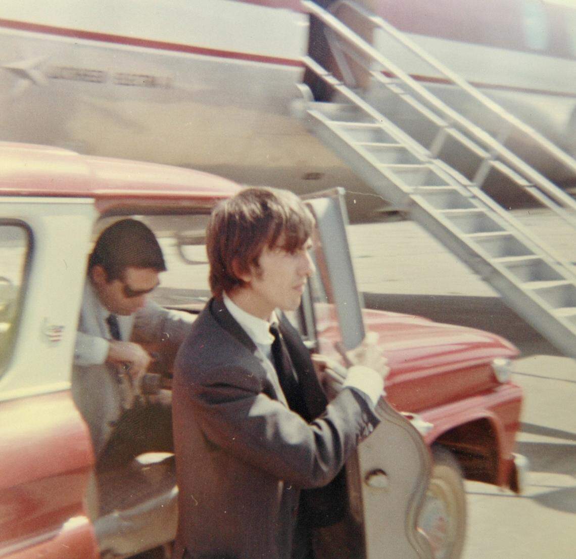 The late George Harrison bypasses hundreds of screaming fans by taking a Suburban right up to the entrance to the Beatles’ plane in Walnut Ridge, Ark., in a Sept. 19, 1964 file photo. Walnut Ridge had the only airport in the region that could handle the superstars’ New York-bound jet.