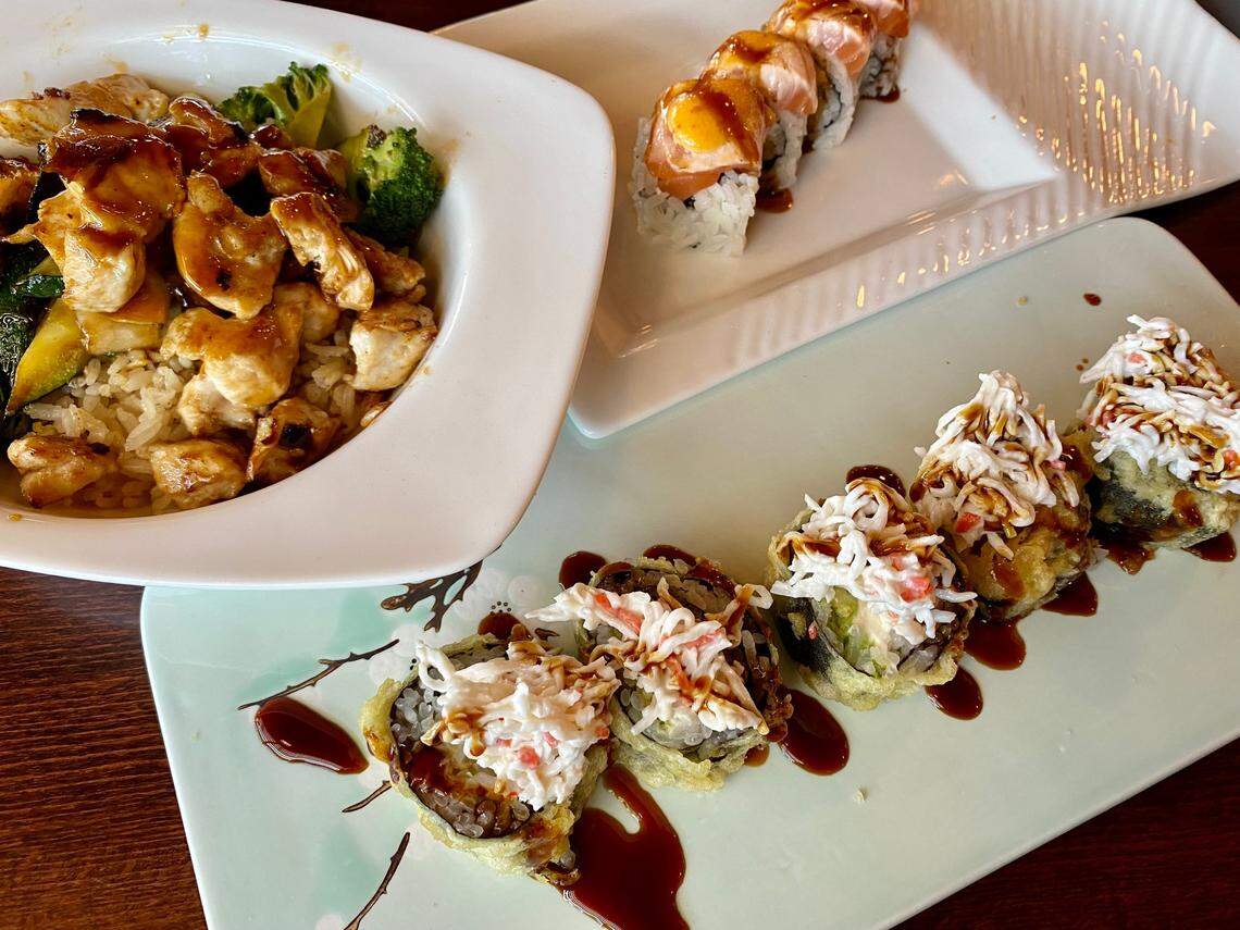 Hibachi chicken, a “crazy salmon” roll (background) and an I-20 roll at Japan House in North Richland Hills.