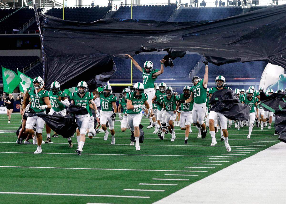The Southlake Carroll Dragons enter the field to face Highland Park, Thursday night, August 26, 2021 played at AT&T Stadium in Arlington, TX. (Steve Nurenberg Special to the Star-Telegram)