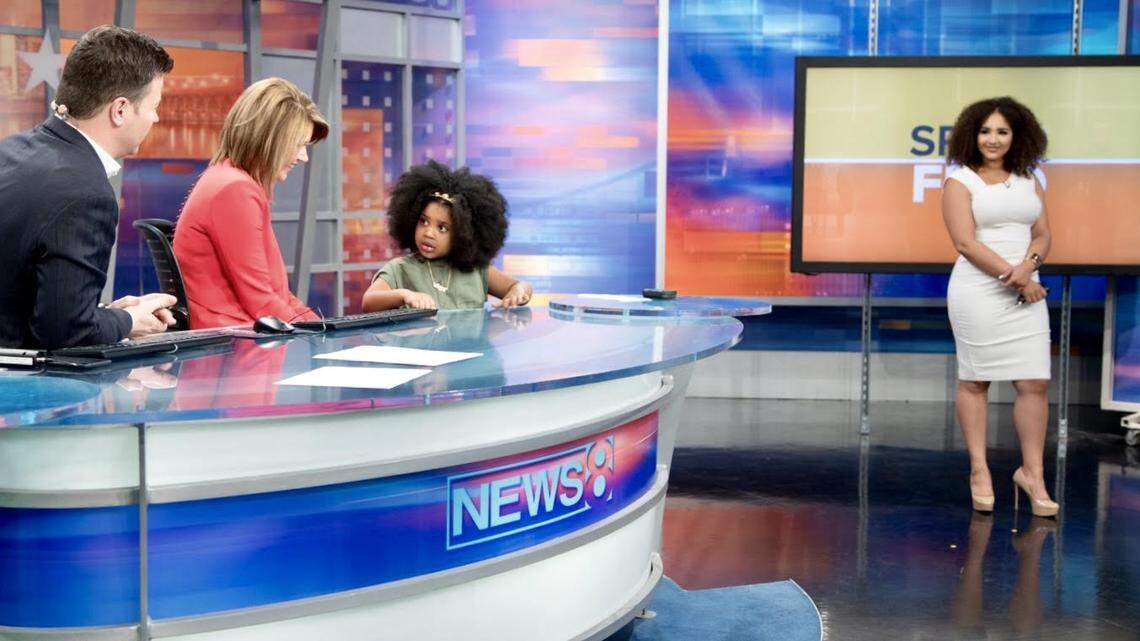 WFAA/Channel 8 traffic reporter Demetria Obilor, right, looks on as "News 8 Daybreak" anchors Ron Corning and Kara Sewell interview Karsyn, a 4-year-old girl invited on the show after her mother tweeted about Karsyn liking to watch "Miss Demetria" on the show.