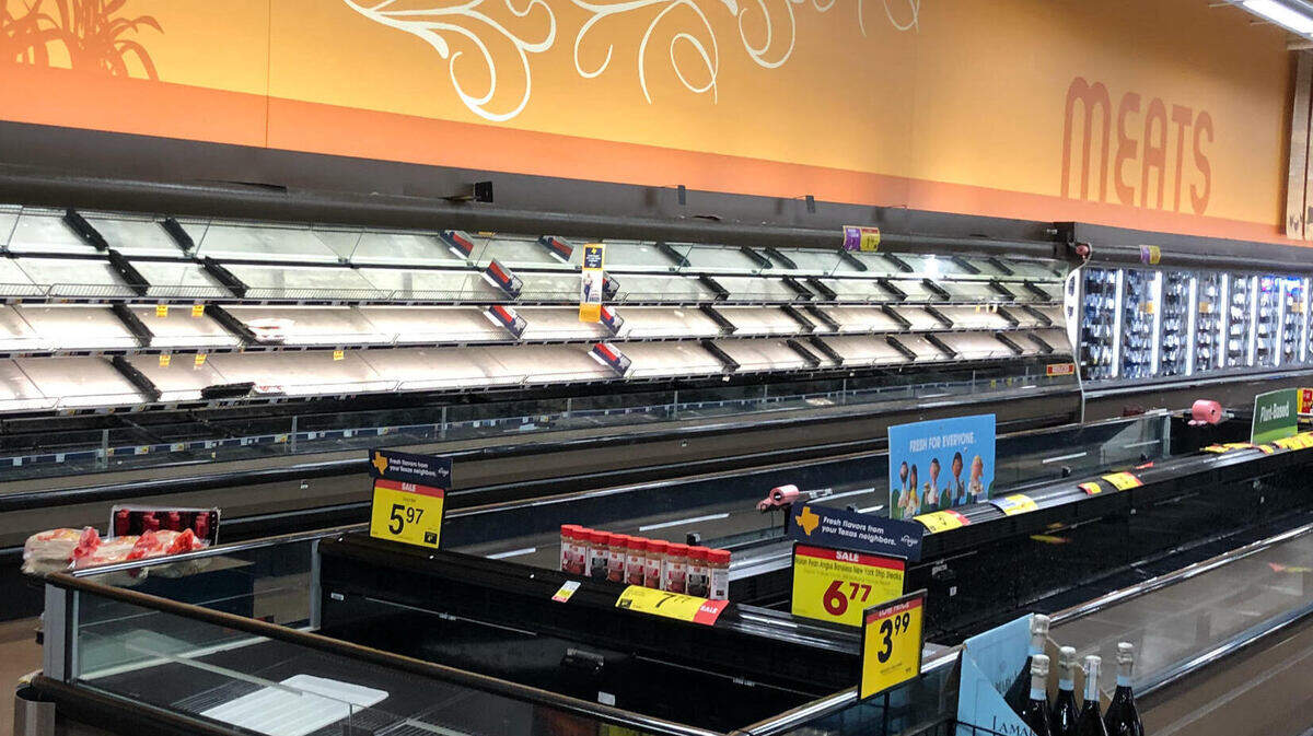 Refrigerated meat cases were empty at Kroger Marketplace at 9150 N. Tarrant Parkway in North Richland Hills on Tuesday. Perishable items had been removed from sale.