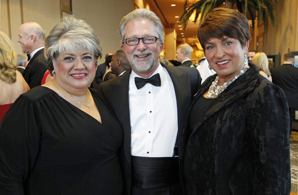 Rosa Navahar, left, with David and Melissa Goodroe at the black tie gala celebrating the USS Fort Worth in Galveston, Texas on Friday September 21, 2012. (Star-Telegram/Ron T. Ennis)