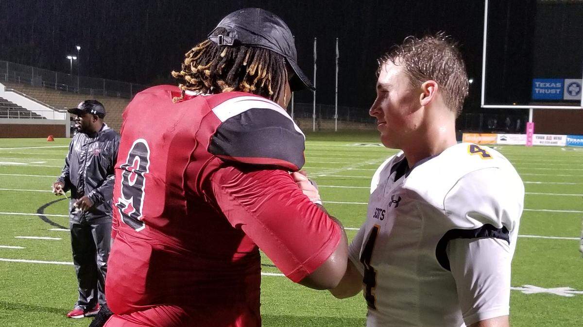 Mansfield Legacy defensive lineman Taurean Carter (9) congratulates Highland Park quarterback Chandler Morris (4) after the Scots beat the Broncos 28-7 at Newsom Stadium.