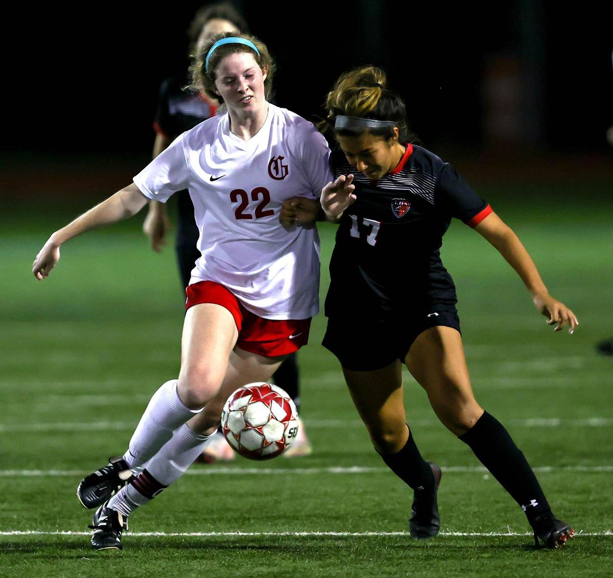 Grapevine’s Sydney Martin (22) and Mansfield Legacy’s Priscilla Perez (17) fight for a loose ball during the first half of the 5A Region 1 area round girls soccer playoffs played on March 30 2021, at Cravens Field in Arlington, TX. (Steve Nurenberg Special to the Star-Telegram)