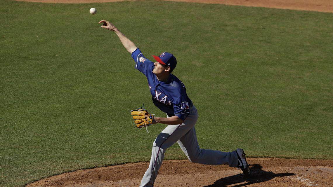 Texas Rangers pitcher Luke Farrell throws during the fourth inning of a spring training baseball game against the Kansas City Royals Saturday, Feb. 23, 2019, in Surprise, Ariz. (AP Photo/Charlie Riedel)