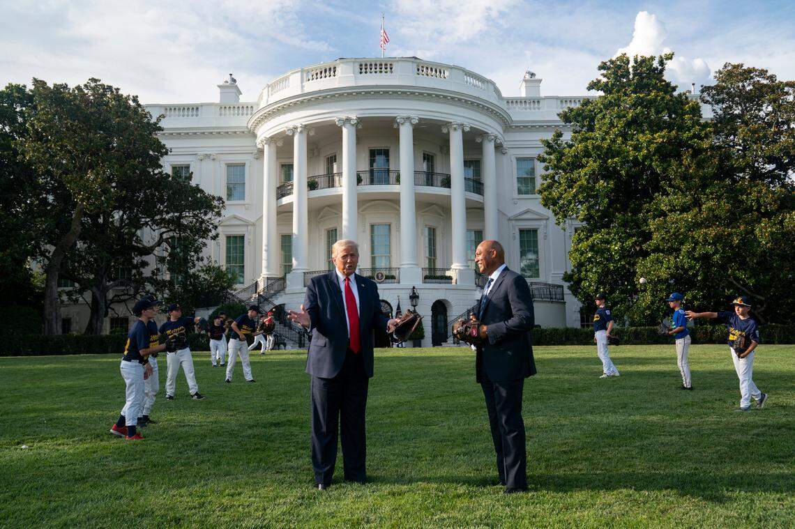 President Donald Trump talks with former New York Yankees Hall of Fame pitcher Mariano Rivera as he greets youth baseball players on the South Lawn of the White House to mark Opening Day for Major League Baseball, Thursday, July 23, 2020, in Washington. (AP Photo/Evan Vucci)