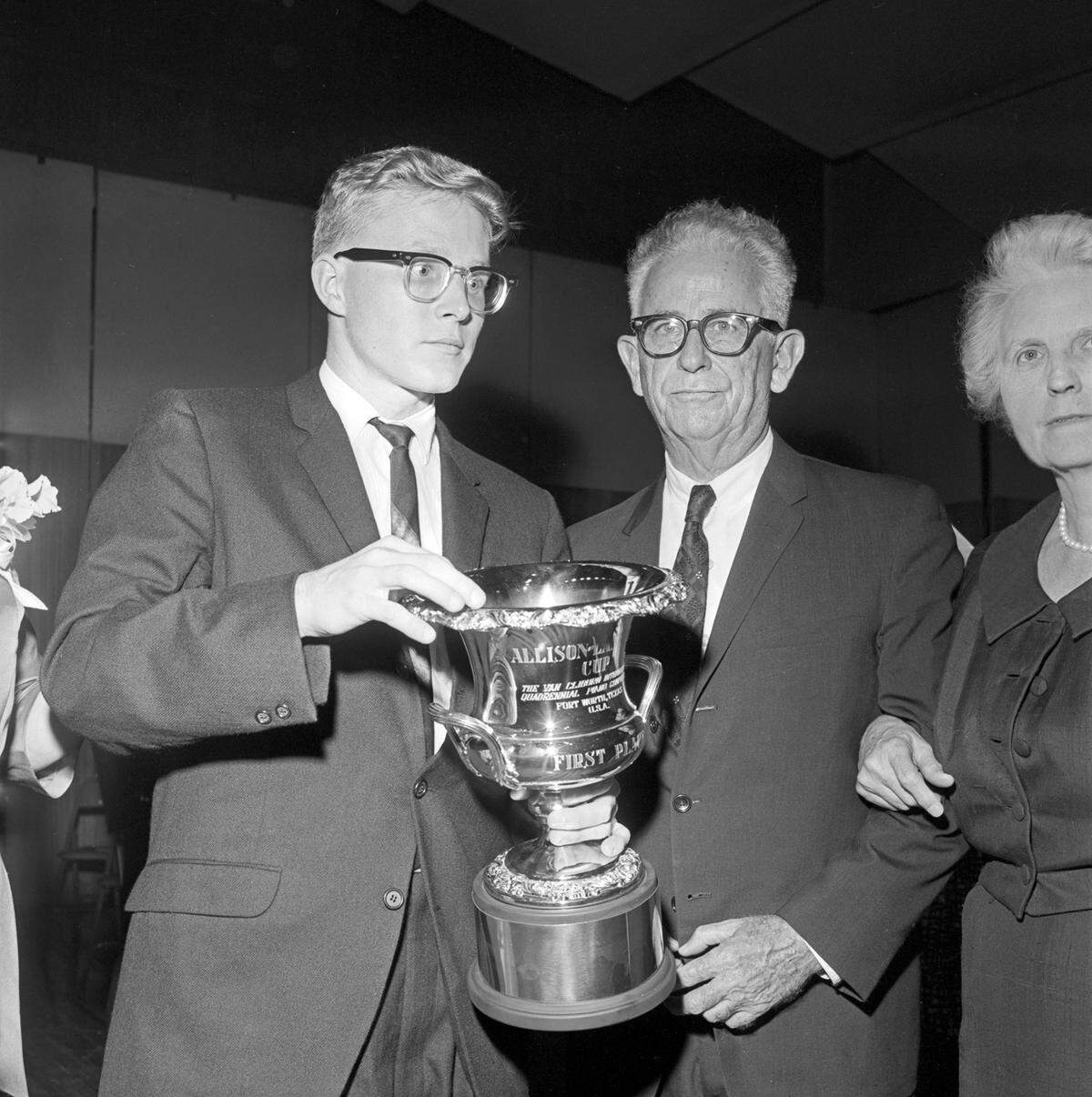 Ralph Votapek, winner of the first Van Cliburn International Piano Competition, holds the Allison-Lankford Gold Cup. The 18-inch trophy is named in honor of Irl Allison, center, president of the National Guild of Piano Teachers, and Grace Ward Lankford, co-founder of the Fort Worth Piano Teachers Forum and founder of the Cliburn competition.