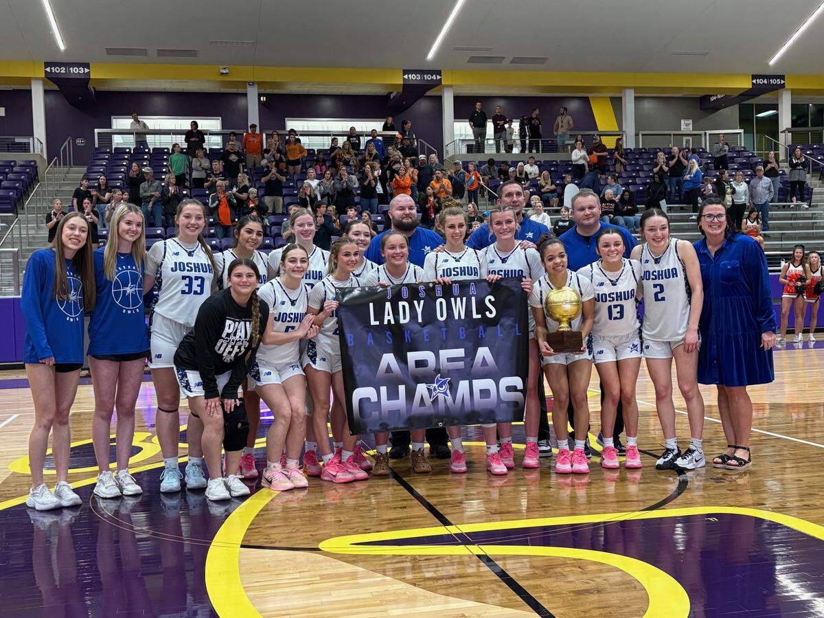 The Joshua girls basketball team poses with the hardware after defeating Aledo in a girls UIL Class 5A Division I area playoff game on Thursday, February 19, 2026 at Godley High School in Godley, Texas.