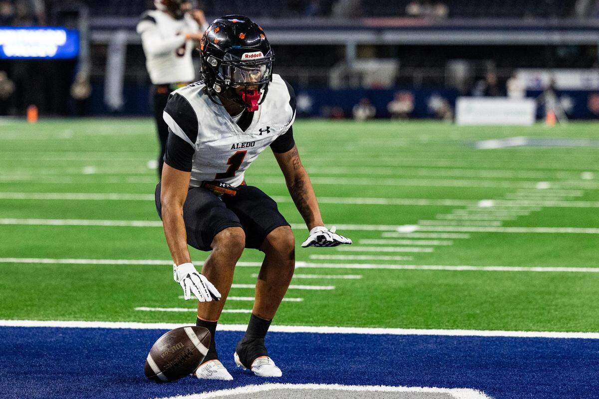Aledo running back Hawk Patrick-Daniels (1) celebrates after running in for a touchdown in the second quarter of the 5A Division I Football State Championship game against the Comal Smithson Valley Rangers at AT&T Stadium in Arlington on Friday, Dec. 15, 2023.