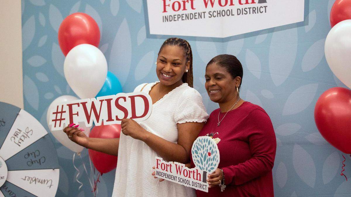 Fort Worth teachers make the most in the region, according to a new analysis. The salaries attract new teachers like Shaquila Anderson, pictured here with a school administrator after accepting a new position at Bill J. Elliott Elementary School during a career fair in June.