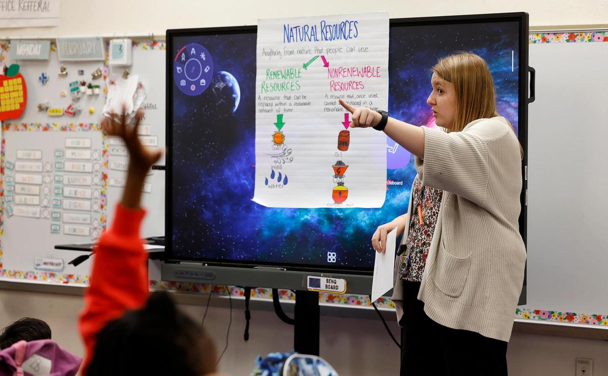 Fourth-grade teacher Chloe Marshall leads her students through a lesson at Clifford Davis Elementary School in Fort Worth on Feb. 3.