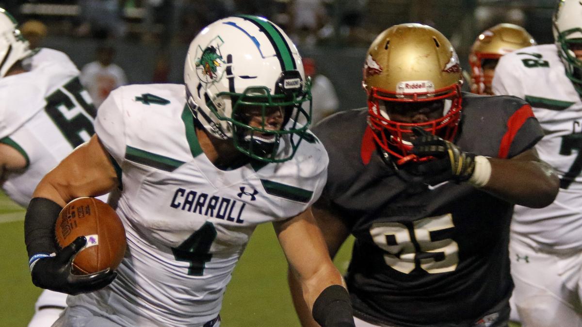 Southlake Carroll running back TJ McDaniel (4) outruns South Grand Prairie nose tackle Kevin Harris (95) around the right side as Southlake Carroll played South Grand Prairie in high school football at The Gopher-Warrior Bowl Thursday August 30, 2018. Carroll defeated SGP 25-8.