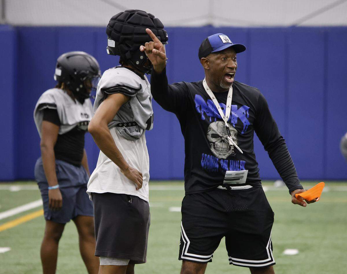 North Crowley defensive coordinator Rodney Ingram puts his unit through drills during their first practice for the 2025 season Thursday.