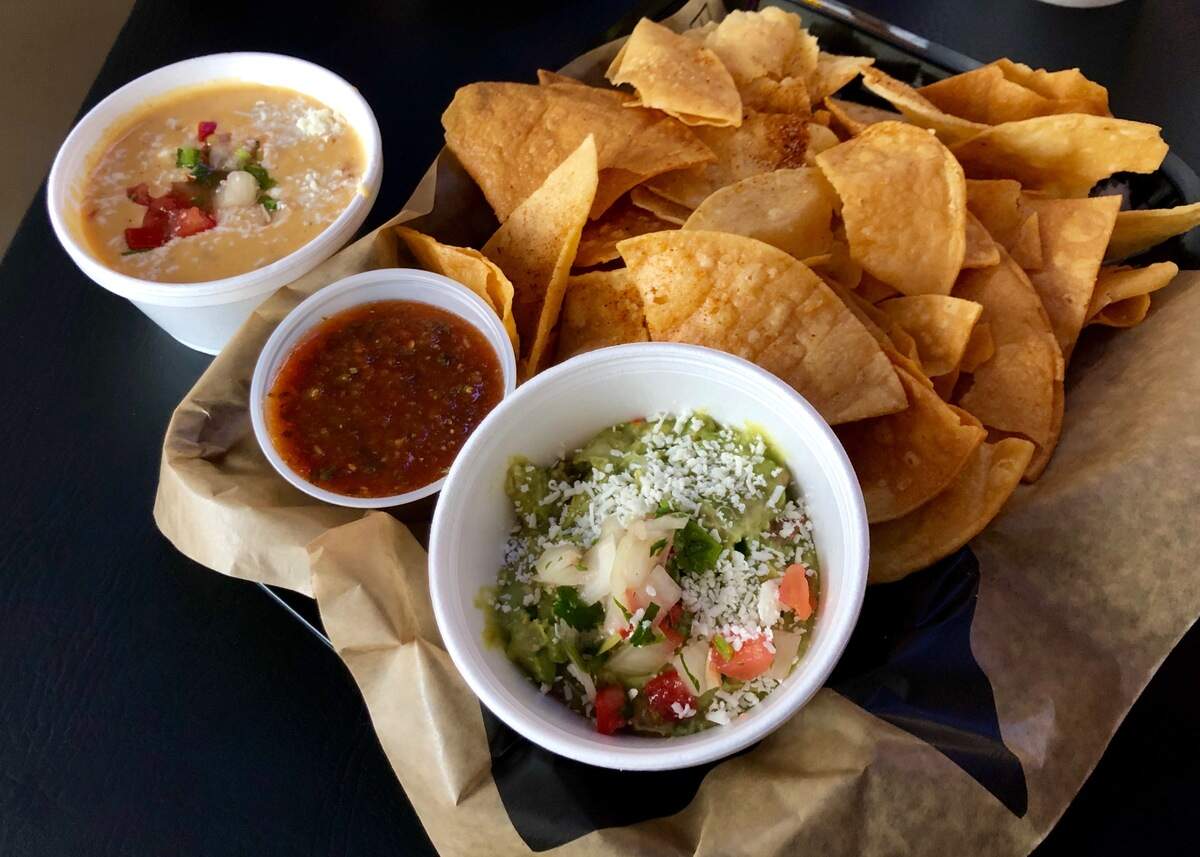 Chile powder-dusted chips with guacamole, queso and salsa at Downtown Cantina in Weatherford.