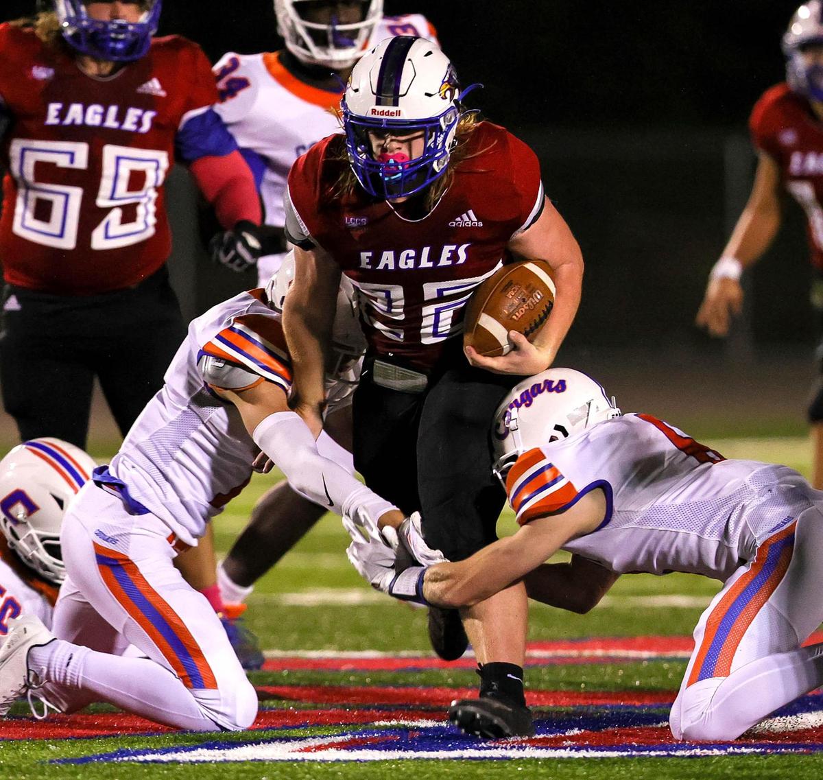 Lake Country running back fullback Adam Lindsey (22) tries to break some tackles against Colleyville Covenant during the first half of a high school football game, October 30, 2020 played at Lake Country Christian School in Fort Worth, Tx. (Steve Nurenberg Special to the Star-Telegram)