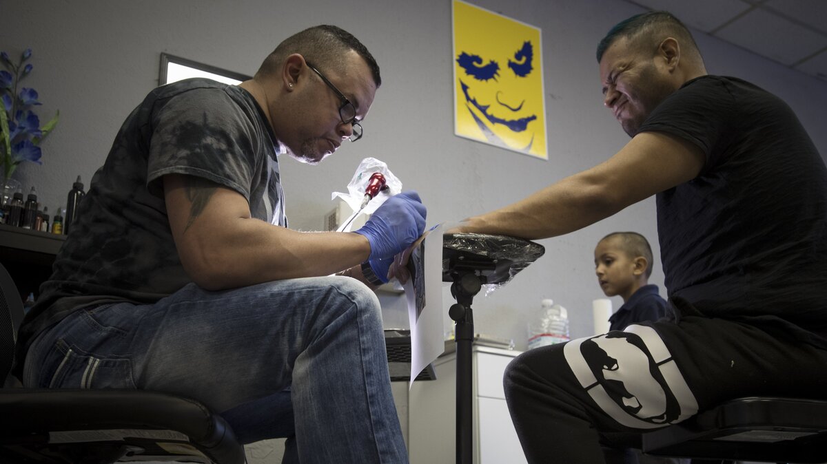 Wilfredo Colon works on a tattoo for Arturo Escalona. Colon is a 42-year-old tattoo artist who moved to Fort Worth from Puerto Rico in December after his city was left without electricity and water after Hurricane Maria in September. Now he has his own tattoo parlor called Latinos Tattoo.
