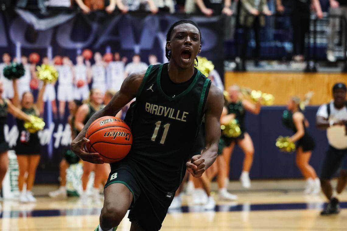 Birdville guard D.J. Driver (11) screams in celebration with the ball after the clock expired and the Hawks defeated Denton 50-49 in a UIL Class 5A Division I regional final at Flower Mound High School in Flower Mound, Texas, Friday, March 6, 2026.