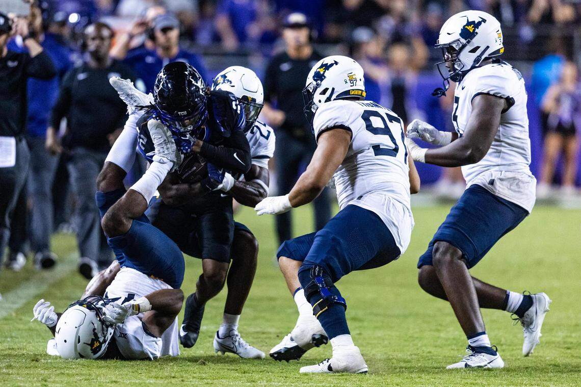 TCU wide receiver Major Everhart (22) gets tackled in the fourth quarter of a Big XII conference game between the TCU Horned Frogs and the West Virginia Mountaineers at Amon G. Carter Stadium in Fort Worth on Saturday, Sept. 30, 2023. The Horned Frogs lost 24-21.