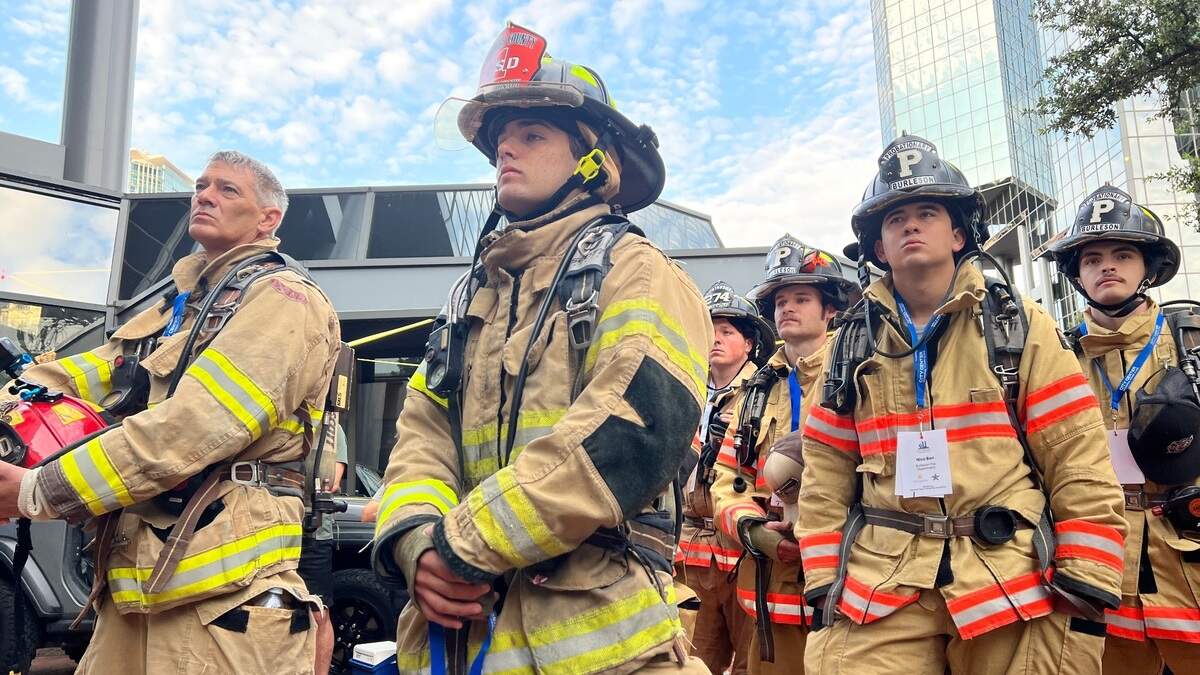 Retired firefighter Kevin Hornick, left, with helmet in his arms, and to right his son, Preston Hornick, participate in Sunday’s 9/11 memorial climb at the Bank of America Tower in downtown Fort Worth. Preston Hornick begins his career as a firefighter on Sept. 19 with the Lake Worth Fire Department.