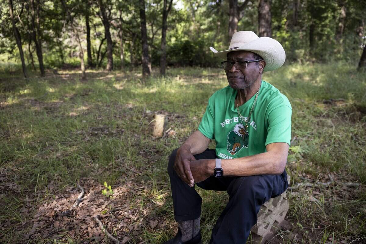 Activist Willie Hudspeth reflects at St. John's Cemetery on Saturday, May 9, 2026, in Pilot Point, Texas. “I'm just sitting here on this stone and just looking out here reflecting of the people that had no voice. No voice at all, and were just thrown away as it were.” Hudspeth said.