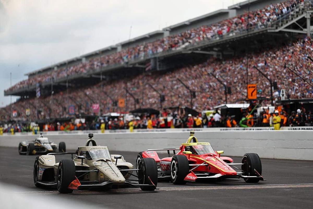 INDIANAPOLIS, INDIANA - MAY 24: Felix Rosenqvist, driver of the #60 Meyer Shank w/ Curb-Agajanian Honda crosses the finish line to win ahead of David Malukas, driver of the #12 Team Penske Chevrolet during the NTT IndyCar Series 110th Running of the Indianapolis 500 at Indianapolis Motor Speedway on May 24, 2026 in Indianapolis, Indiana. (Photo by James Gilbert/Getty Images)