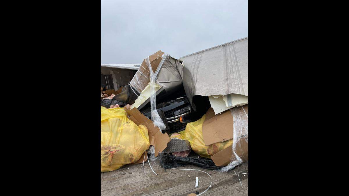 An 18-wheeler was split open after a crash near Texas Motor Speedway and Roanoke on Thursday, Feb. 24, officials said. Two Northlake police officers were involved in the accident and were among four people injured.