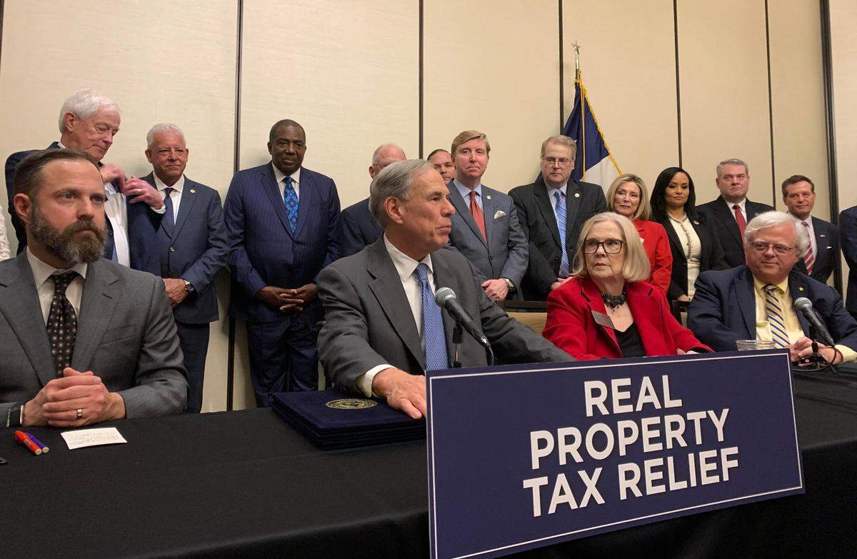 Greg Abbott signed three property tax exemption bills on June 18, 2025 in Denton County beside the three bills’ authors, Sen. Paul Bettencourt and Rep. Morgan Meyer.