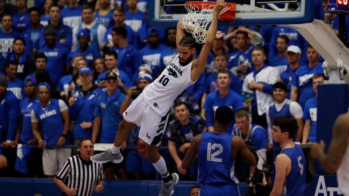 Nevada Wolf Pack forward Caleb Martin (10) slams the ball against the Air Force Academy earlier this season.