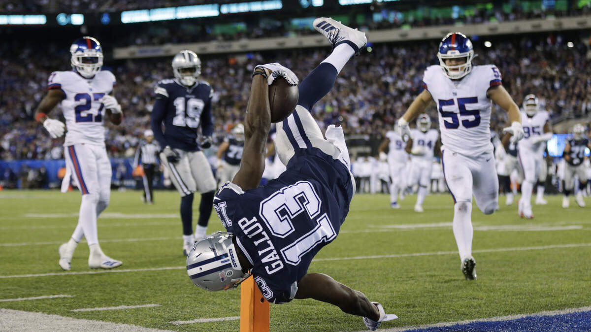Dallas Cowboys wide receiver Michael Gallup stays in bounds as he flips over the goal line to score a touchdown against the New York Giants.