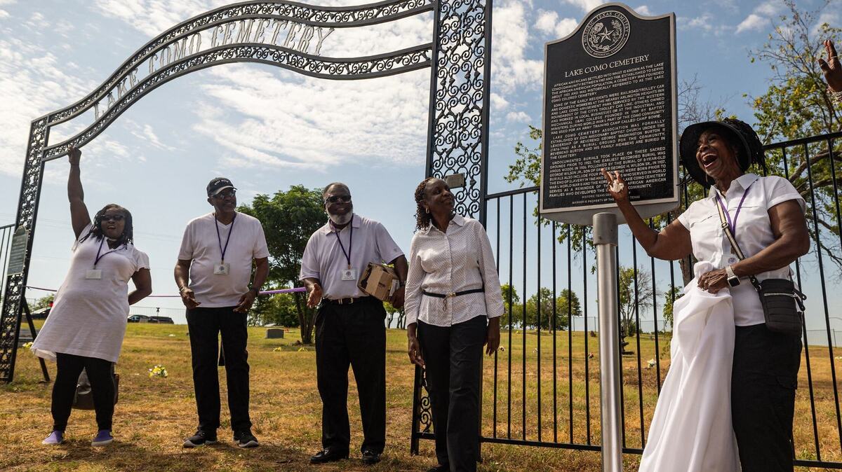 Members of the Lake Como Cemetery Association unveil the historical marker plaque during the dedication ceremony at the Lake Como Cemetery in Como on Saturday, July 6, 2024.