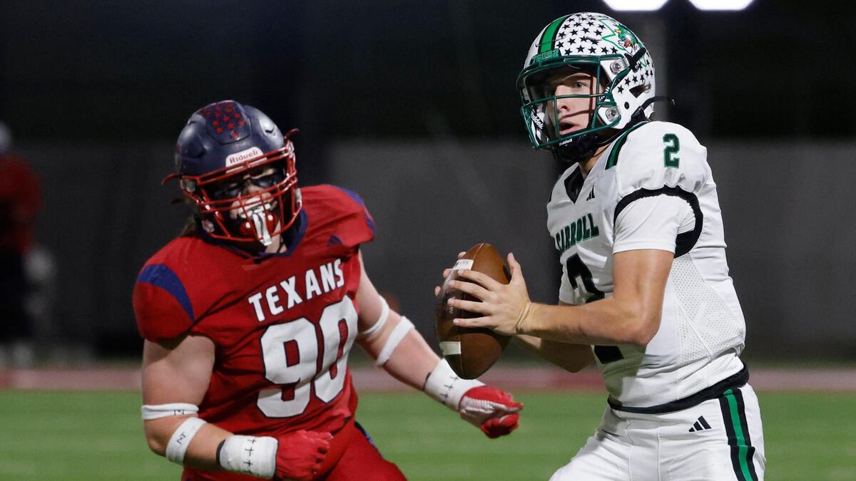 Southlake quarterback Angelo Renda (2) looks for a receiver down field pursued by Northwest defensive lineman Jace Starnes (90) during a District 4 6A football game at Northwest ISD Stadium in Justin, Texas, Thursday, Oct. 17, 2024.