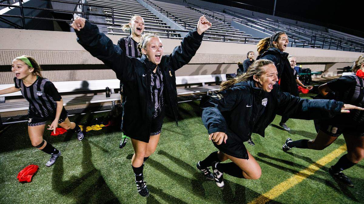 April 6, 2018; Dallas, TX, USA. The Mansfield Tiger bench runs onto the field following a 2-0 victory over the Keller Central Chargers in a UIL girls regional quarterfinals soccer game at Pennington Field in Arlington, TX.