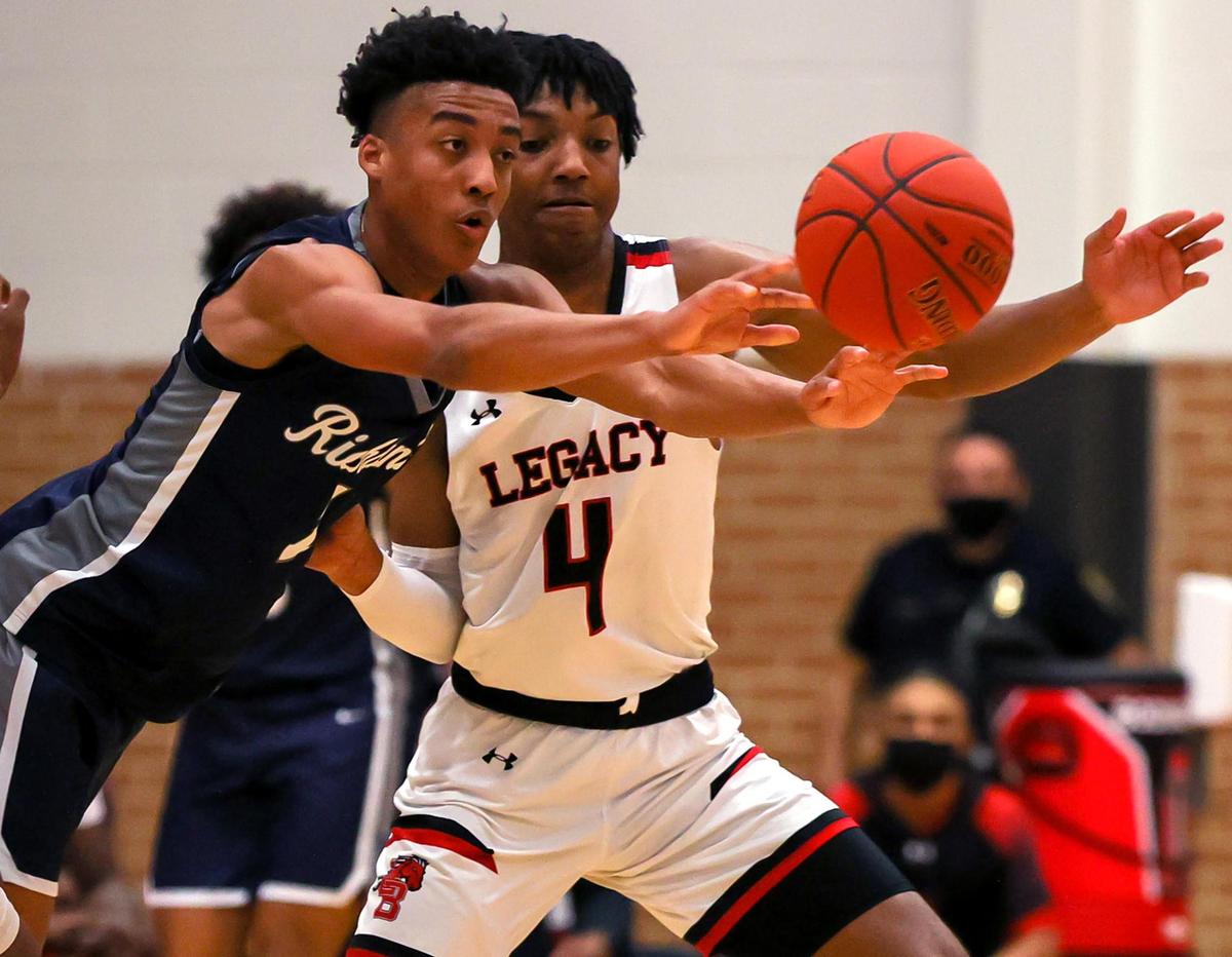 Richland guard Jourdyn Grandberry (L) tries to get off a pass against Mansfield Legacy guard John Muhammad (4) during the first half of a 5A Region 1 Boys Basketball Area-Round 2 playoff game played on February 24, 2021 at Burleson High School. (Steve Nurenberg Special to the Star-Telegram)