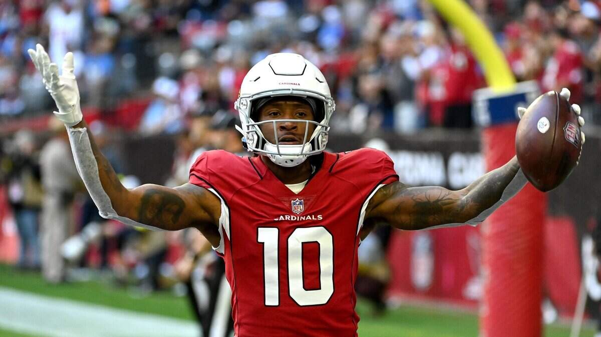 DeAndre Hopkins of the Arizona Cardinals celebrates after scoring a touchdown in the first quarter of a game against the Los Angeles Chargers at State Farm Stadium on Nov. 27, 2022. Hopkins was released by the Cardinals on May 26.