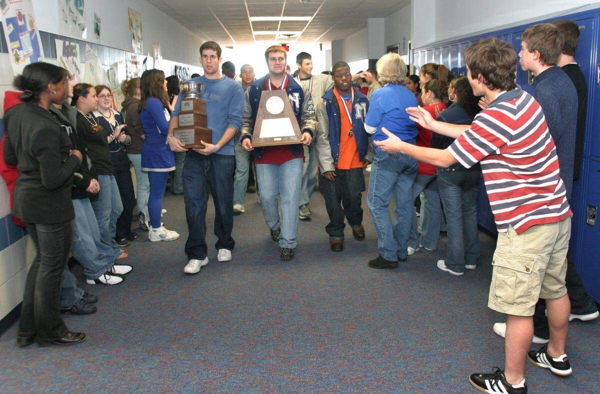North Crowley High School football players walk the halls of North Crowley Ninth Grade Campus, receiving congratulations for their State Championship win. STAR-TELEGRAM PHOTO BY JOYCE MARSHALL 12/16/03