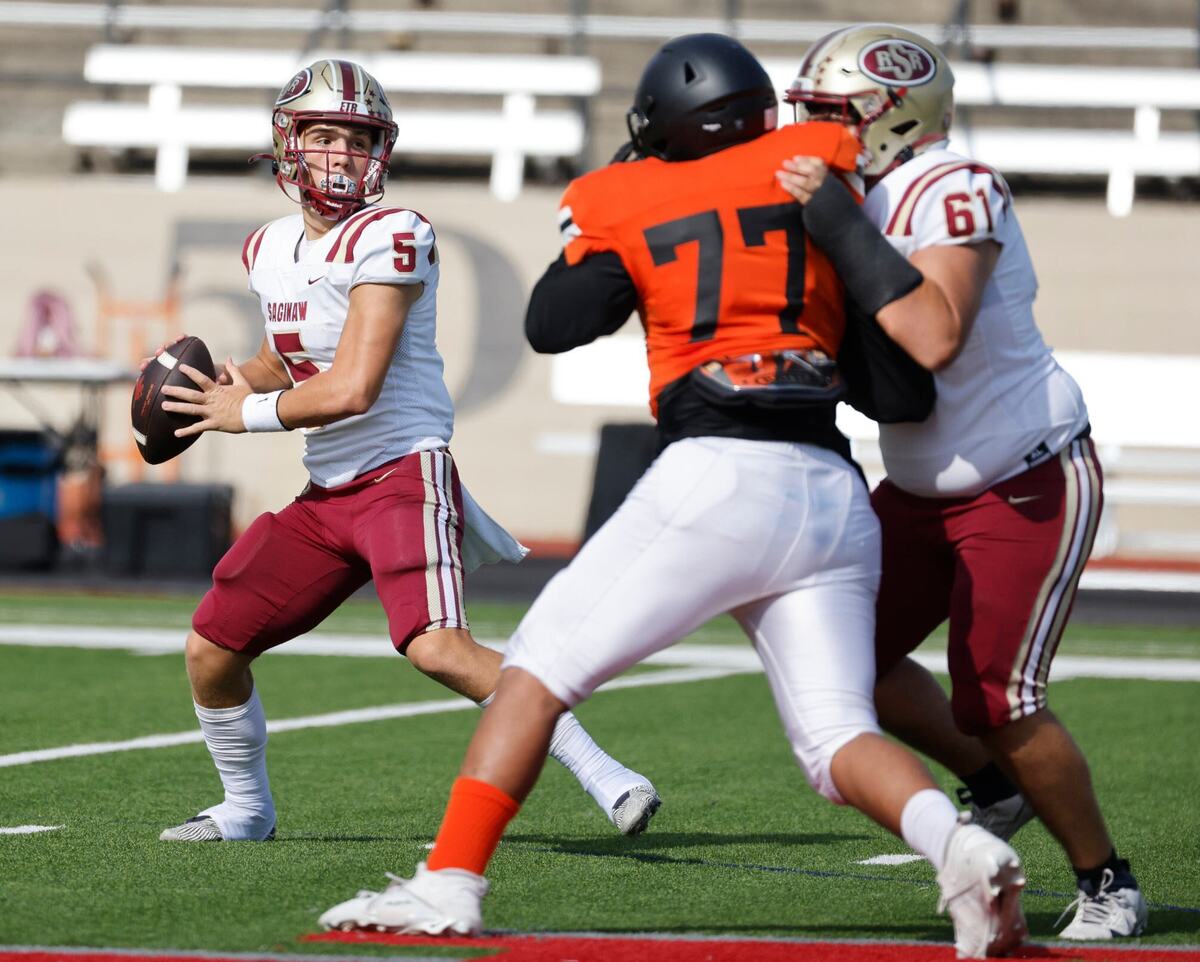 Saginaw quarterback Roman Morales (5) tosses a touchdown pass during a UIL football game at Farrington Field in Fort Worth Saturday, Sept. 14, 2024.