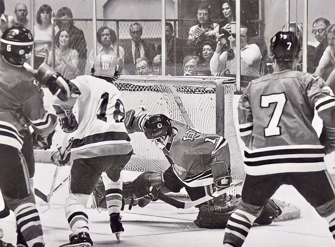 The Fort Worth Texans’ Kelly Greenbank beats Dallas Blackhawks goalie Dave Elenbaas for the game-winning overtime goal in Game 7 of the 1978 Central Hockey League playoffs.