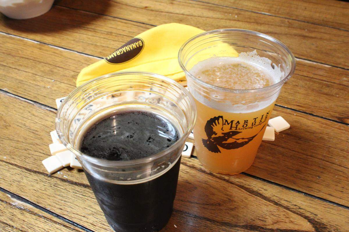 Banana Fest at Martin House Brewing Co. includes playing banana grams while drinking “Sharks With Frickin Laser Beams Attached To Their Heads Pt. 4,” an imperial stout, left, and “The Silk Road,” a hazy IPA, right.