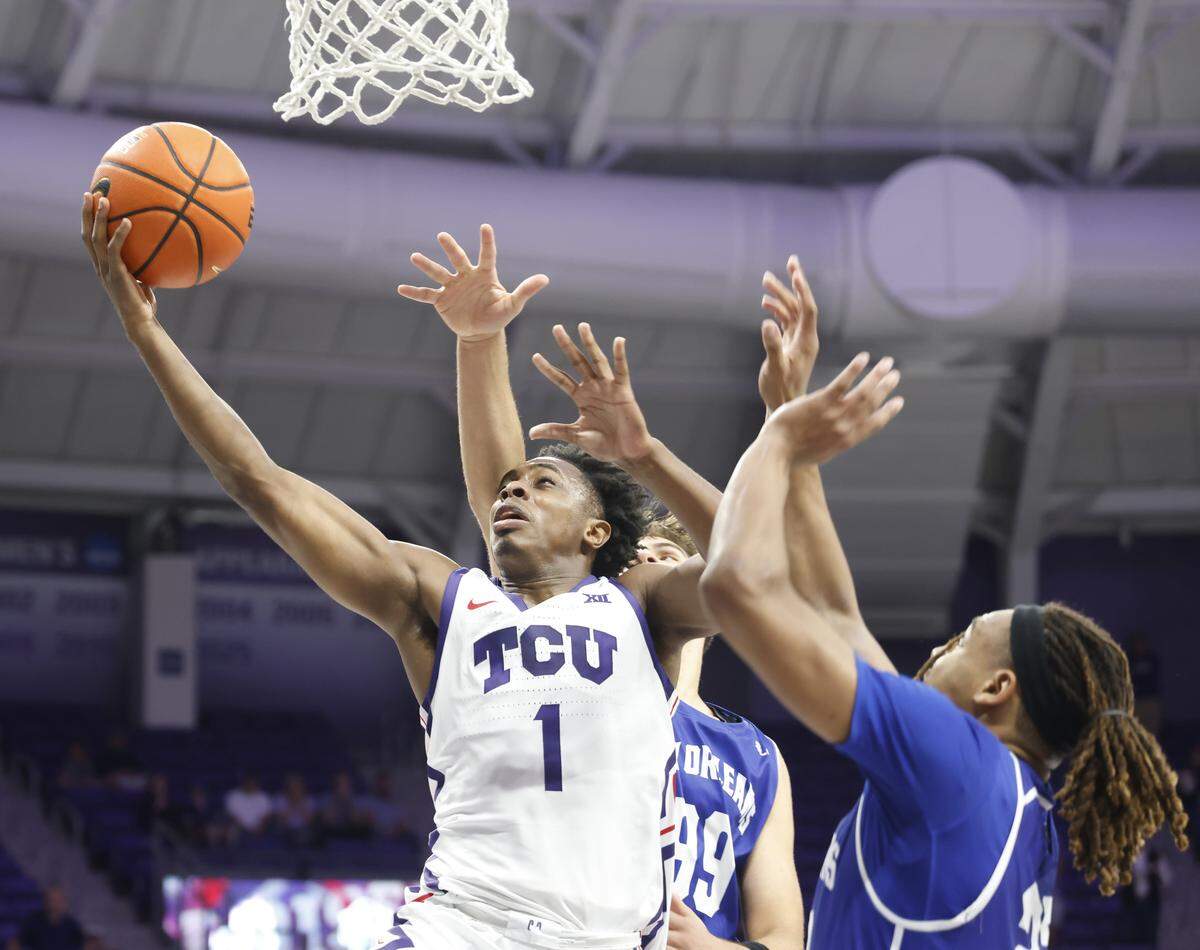 TCU guard Jayden Pierre (1) puts in a layup during the second half of a NCAA basketball game between New Orleans University and TCU at Schollmaier Arena in Fort Worth, Texas, Monday Nov. 03, 2025. The Horned Frogs dropped their home opener 78-74 to the Privateers.