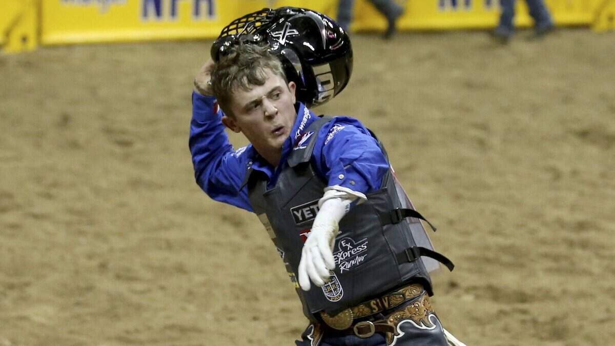 Stetson Wright of Milford, Utah, celebrates his 92.5 ride on Monte Walsh to win the first go-around of the 10-day Wrangler National Finals Rodeo at the Thomas & Mack Center in Las Vegas Thursday, Dec. 5, 2019. Wright is trying to become the first bucking stock rider to win the world all-around title race in 21 years.