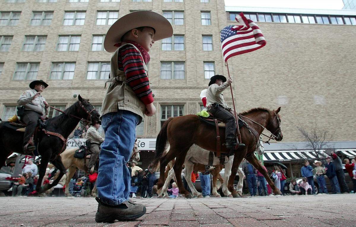 Jan. 17, 2004: Caden Moore, 3, of Arlington, watches as horses pass by during the Fort Wort Stock Show Parade in downtown.