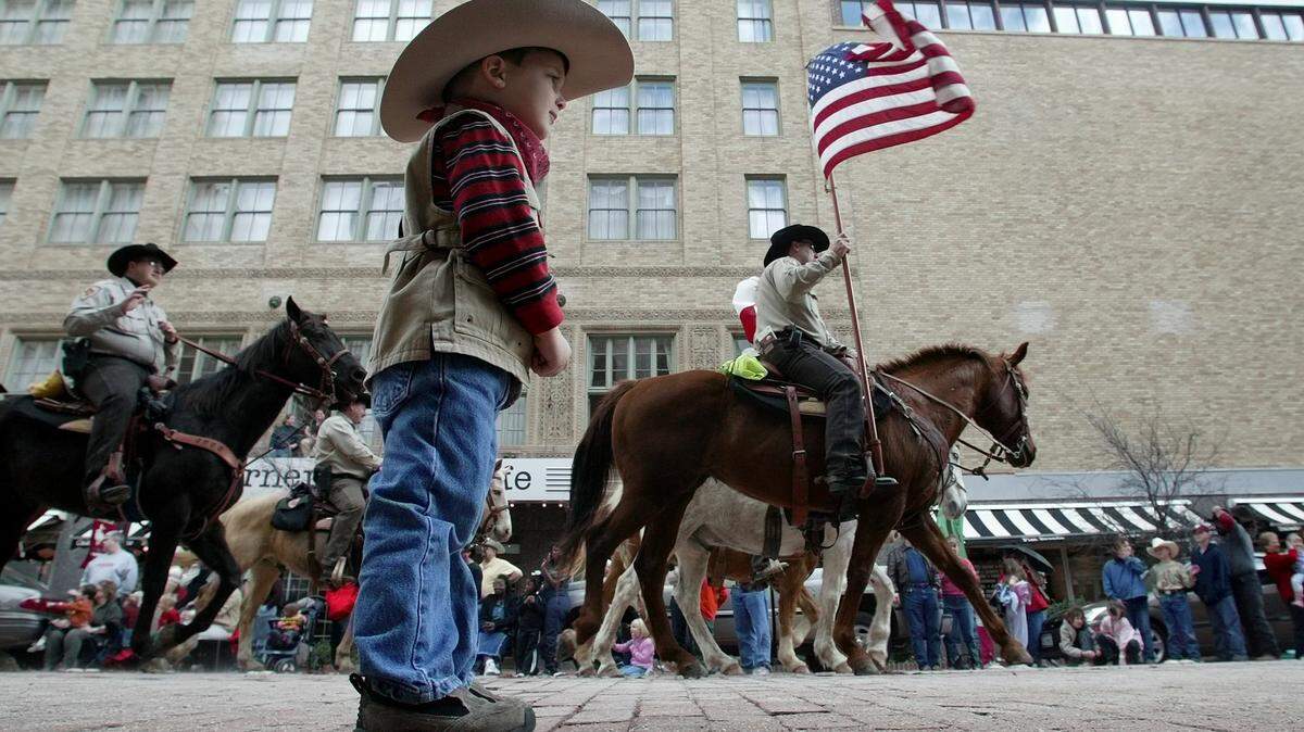 Jan. 17, 2004: Caden Moore, 3, of Arlington, watches as horses pass by during the Fort Wort Stock Show Parade in downtown.