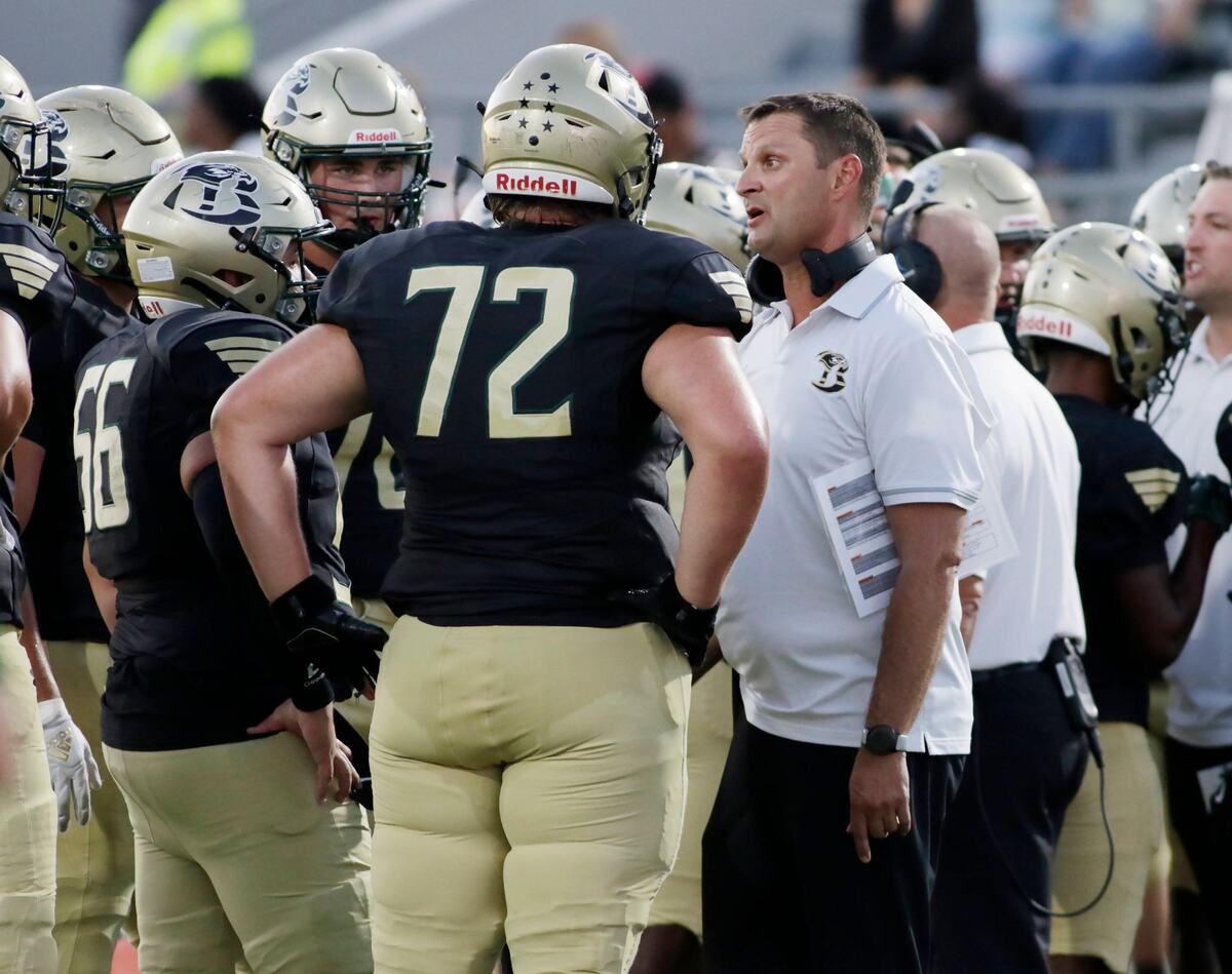 Birdville Head Coach Chris Smith talks with his team during a time out Thursday night at the Birdville Athletic Center. JOHN ROWLAND