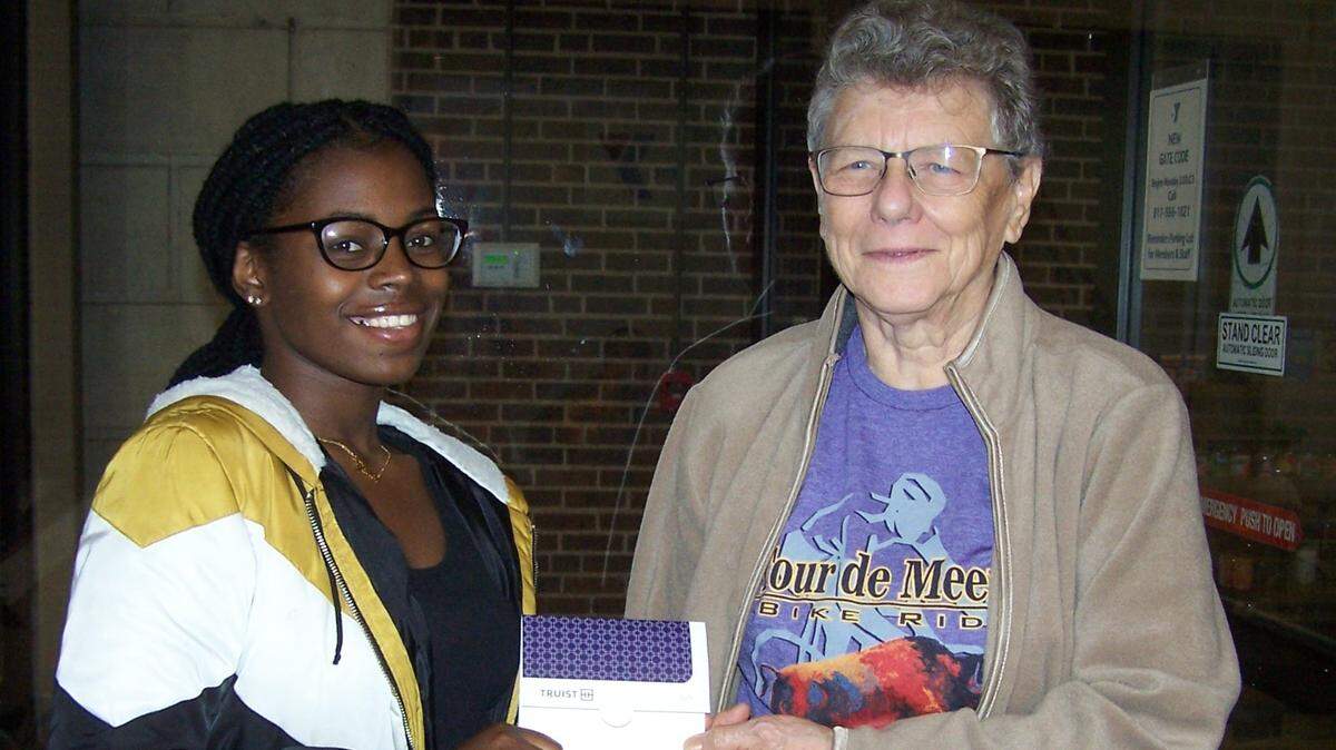 Single mom/college student Divine Giramata is among those taking advantage of the Educational Scholarships for Single Parents program. She is shown with Carol Feyen, who, along with her husband Ray, was on the original board members and still is today. Carol was also one of the original students for the program in Arkansas before bringing a version of it to Fort Worth.