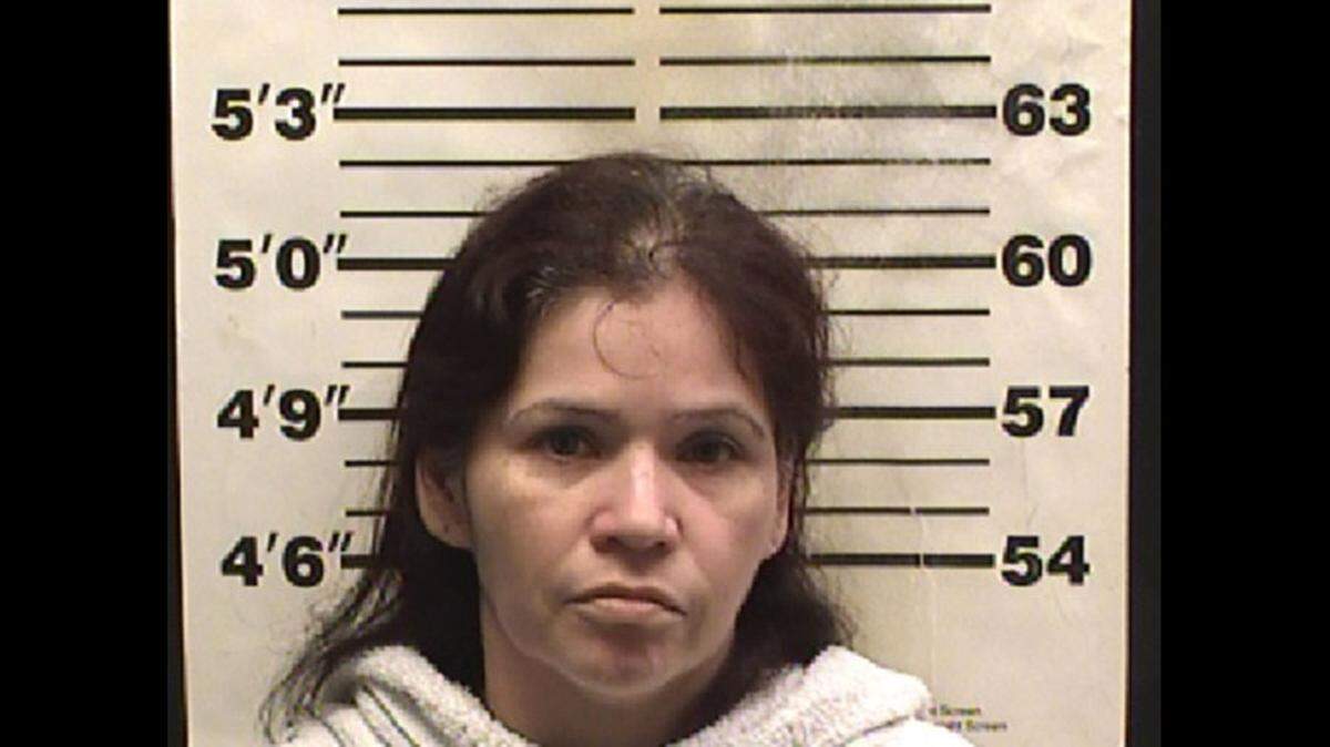 Police have arrested Juana Marquez, 42, after a child died after accidentally spilling boiling water on herself, reports say.