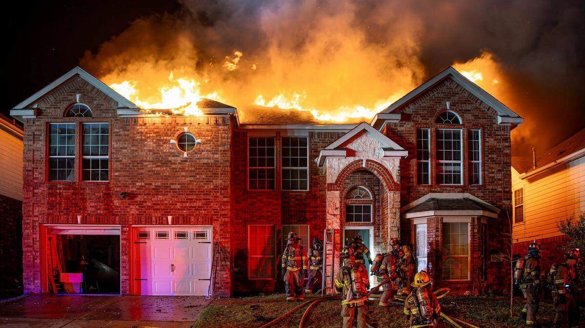 Fort Worth firefighters work the scene of a house fire on Tuesday, Dec. 2, 2025.