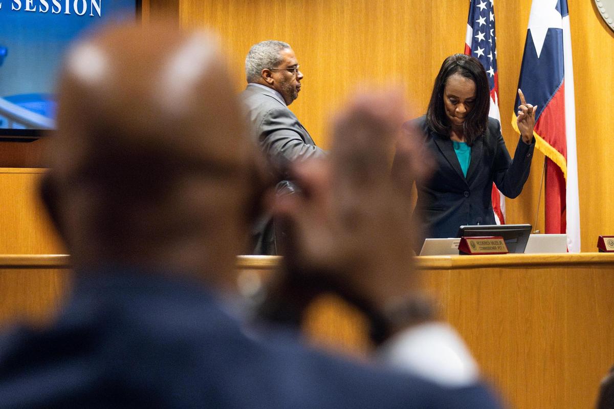 Alisa Simmons, the Tarrant County Commissioner Precinct 2, makes an obscene gesture toward Tarrant County Judge Tim O’Hare after O’Hare interrupted her to call a closed session to discuss parliamentary procedures during a Tarrant County Commissioners Court meeting at the Tarrant County Administration Building in Fort Worth on Tuesday, June 3, 2025. O’Hare argued that Simmons was getting off topic during her commentary and wanted to discuss if she was abiding by county court rules.