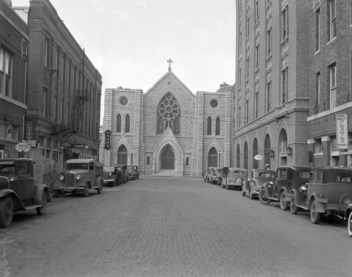A street view of St. Patrick’s Catholic Church, 1206 Throckmorton St., in 1937. Also visible are Paul’s Cafe, Howard Printing and Carl Neely Cleaners on W. 11th St.
