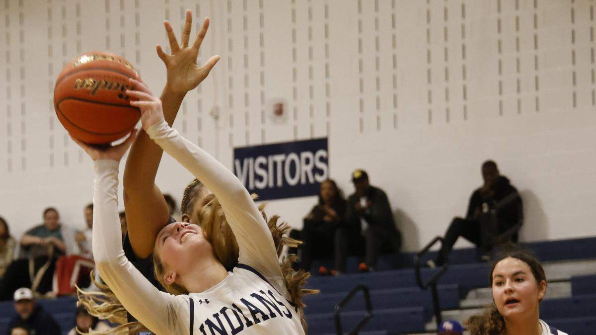 Keller guard Lila Russell (0) is fouled by L.D. Bell point Madi Capers (23) during the first half of a UIL girls basketball game between L.D. Bell and Keller at Keller High School in Keller, Texas, Friday Jan. 16, 2026