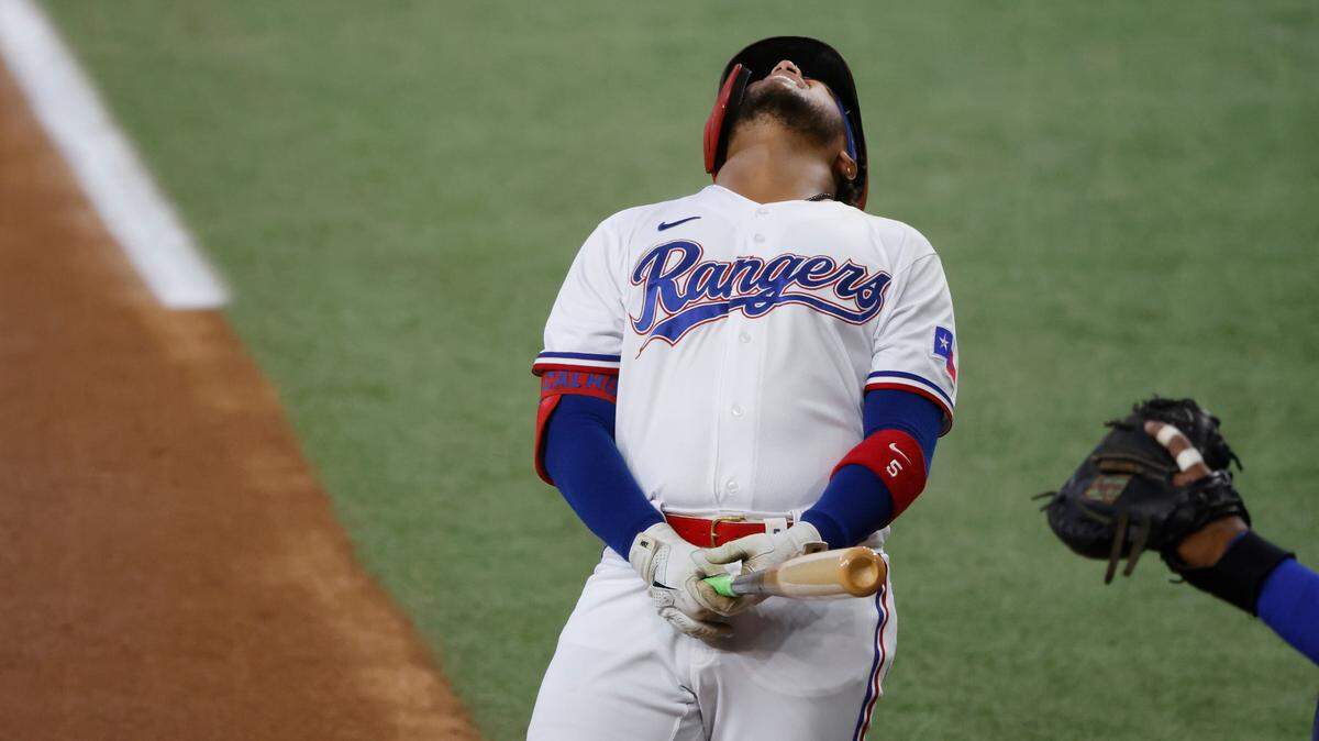 Texas Rangers outfielder Willie Calhoun reacts after being hit on the left forearm in the second inning Saturday. He’ll have surgery to repair a broken arm on Tuesday and he’ll miss the next couple of months.